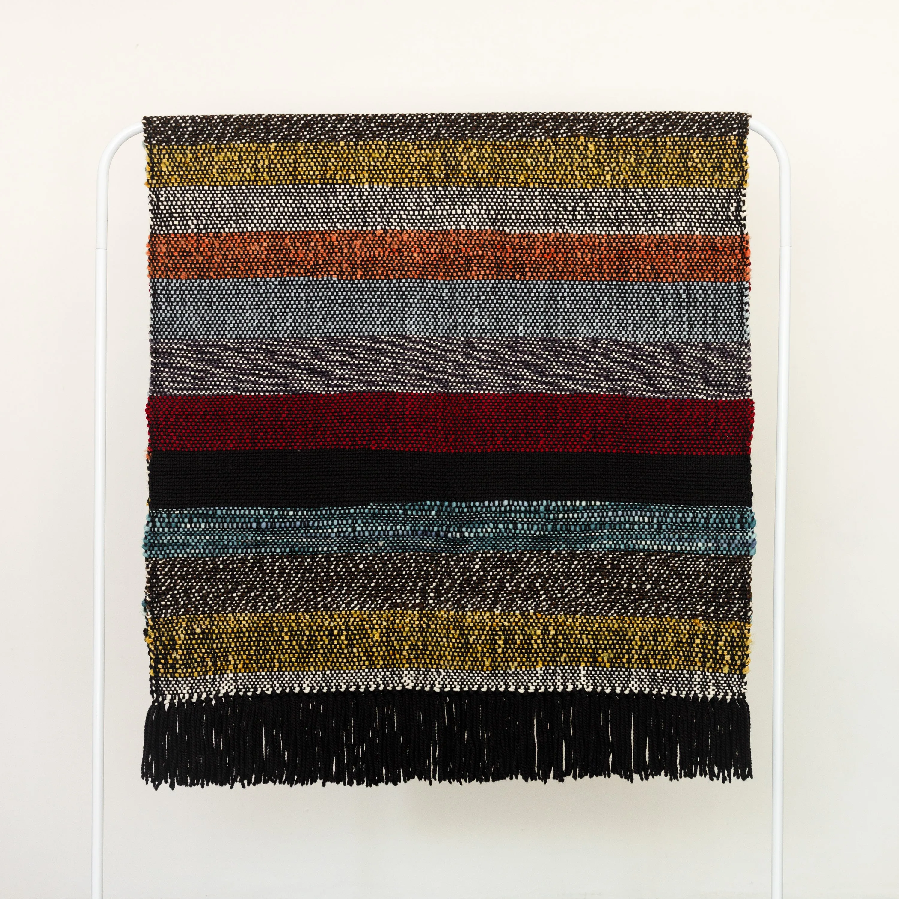 Handwoven Merino Wool Blanket – Black Base with Vibrant Stripes and Fringes