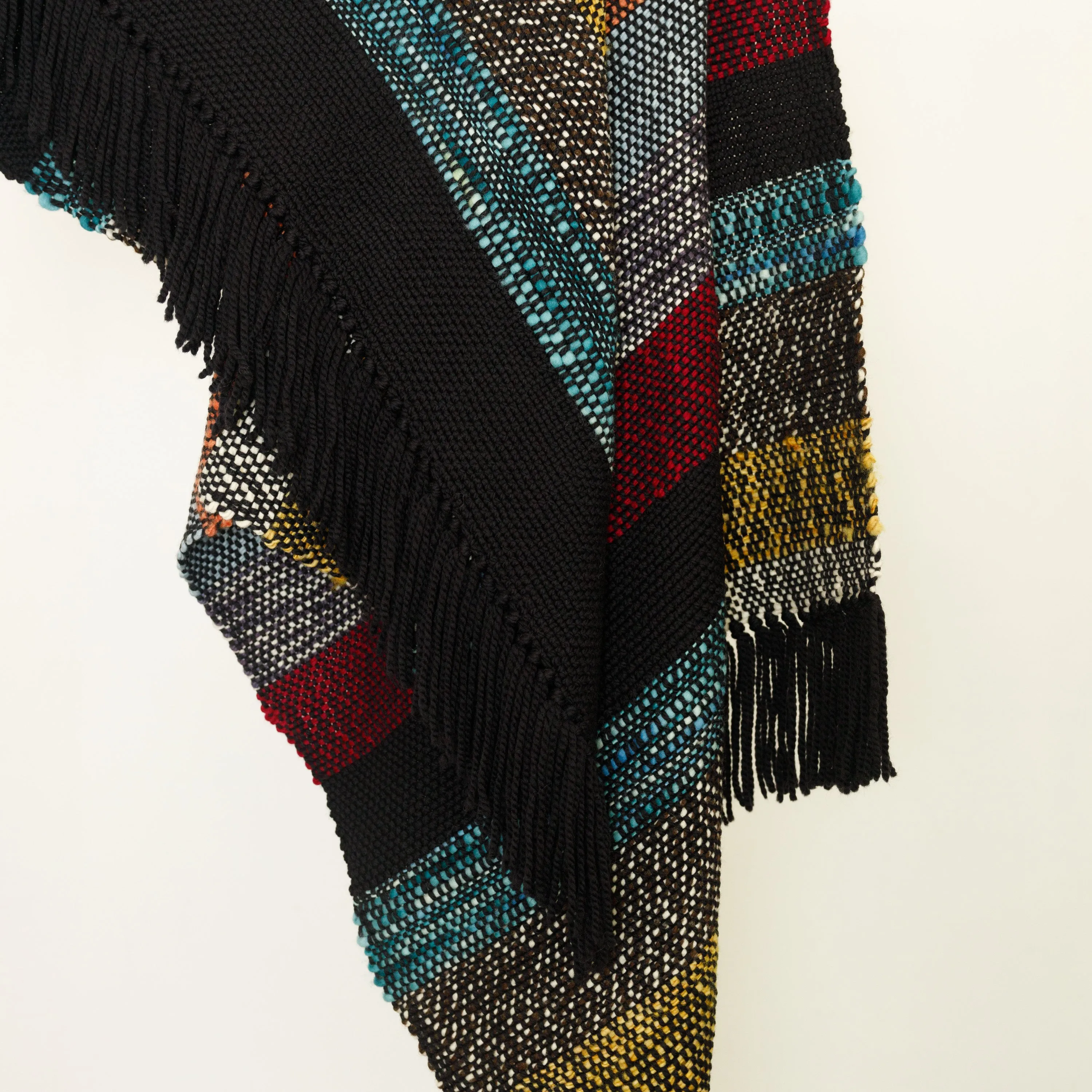 Handwoven Merino Wool Blanket – Black Base with Vibrant Stripes and Fringes